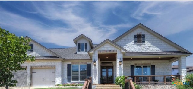 750 Mission Hts, New Braunfels, TX 78130 - view of front of house featuring covered porch, a standing seam roof, an attached garage, a shingled roof, and stone siding