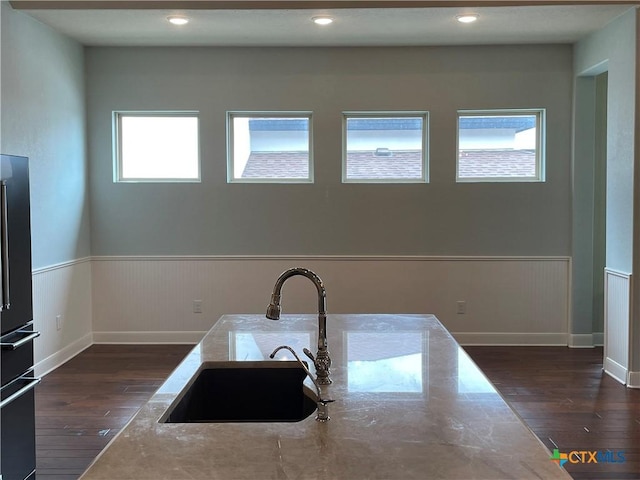 750 Mission Hts, New Braunfels, TX 78130 - kitchen featuring a sink, dark wood-style flooring, wainscoting, and freestanding refrigerator