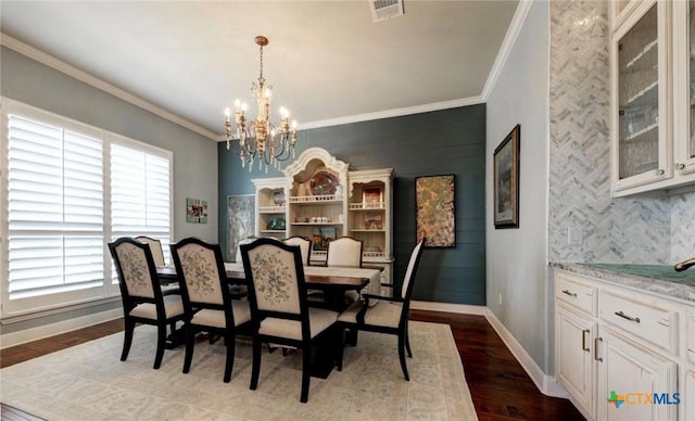 750 Mission Hts, New Braunfels, TX 78130 - dining room with visible vents, crown molding, baseboards, dark wood-style floors, and a notable chandelier