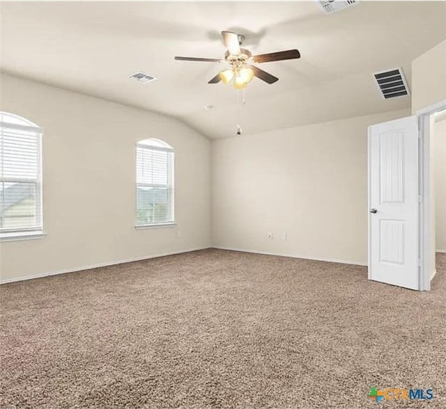 5561 Perdita Dr, Belton, TX 76513 - empty room with visible vents, ceiling fan, carpet flooring, and vaulted ceiling