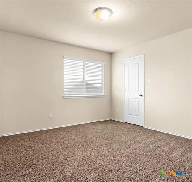 5561 Perdita Dr, Belton, TX 76513 - carpeted empty room with baseboards