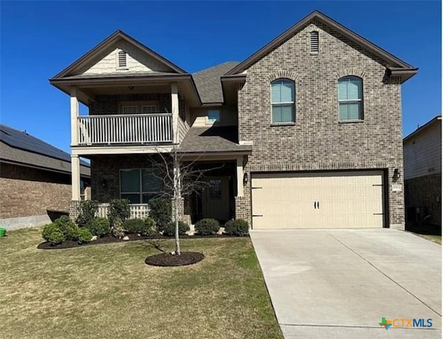 5561 Perdita Dr, Belton, TX 76513 - traditional-style home featuring brick siding, driveway, a balcony, a front lawn, and an attached garage