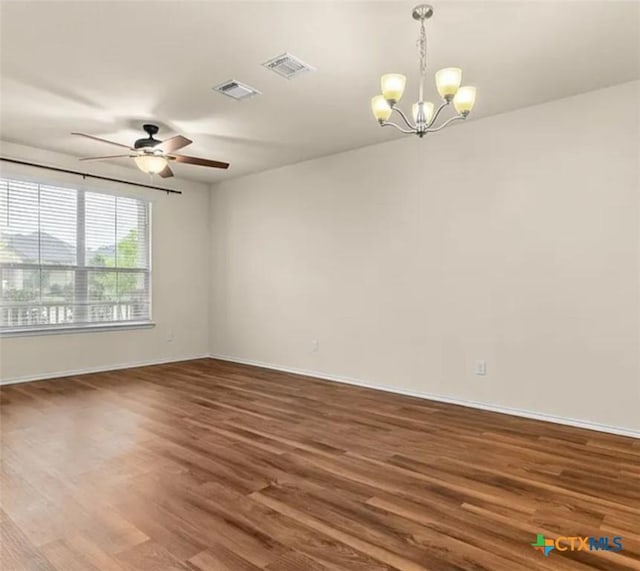 5561 Perdita Dr, Belton, TX 76513 - empty room with baseboards, visible vents, wood finished floors, and ceiling fan with notable chandelier