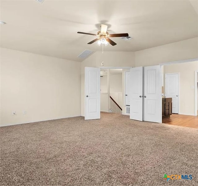 5561 Perdita Dr, Belton, TX 76513 - unfurnished bedroom featuring visible vents, ceiling fan, vaulted ceiling, and light carpet