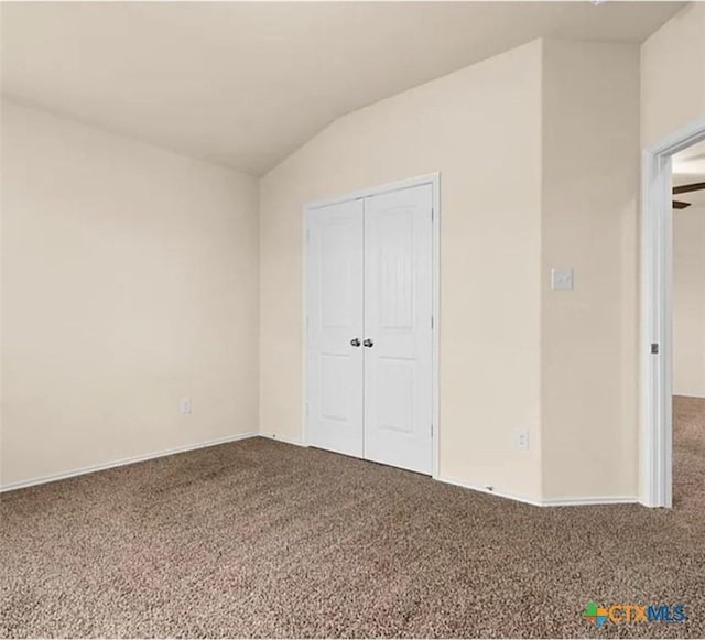 5561 Perdita Dr, Belton, TX 76513 - unfurnished bedroom featuring lofted ceiling, a closet, carpet floors, and baseboards