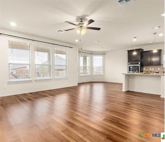 5561 Perdita Dr, Belton, TX 76513 - unfurnished living room with wood finished floors, visible vents, a ceiling fan, and recessed lighting
