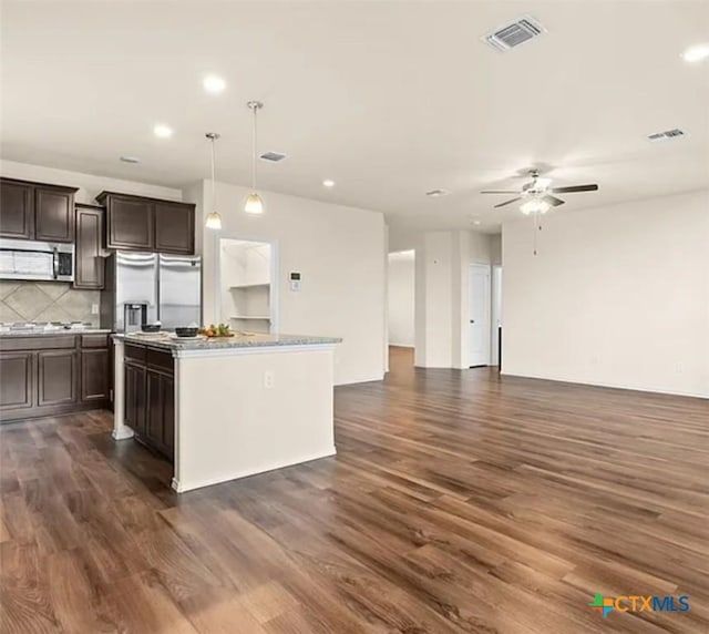 5561 Perdita Dr, Belton, TX 76513 - kitchen with stainless steel appliances, dark wood-style flooring, visible vents, a ceiling fan, and open floor plan