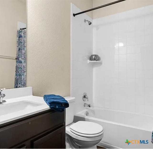 5561 Perdita Dr, Belton, TX 76513 - full bath with a textured wall, toilet, vanity, and shower / tub combo with curtain