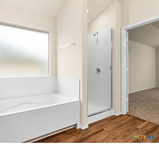 5561 Perdita Dr, Belton, TX 76513 - full bath with baseboards, a stall shower, wood finished floors, and a bath