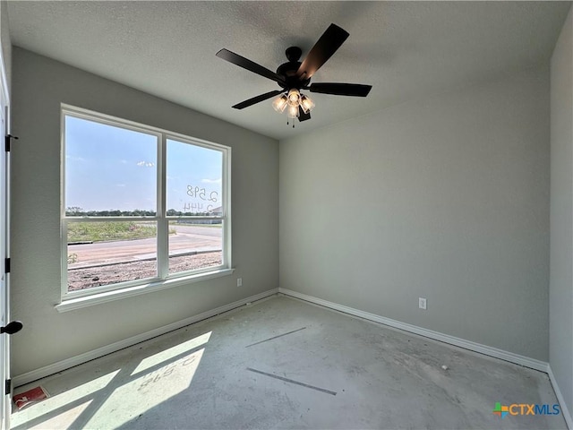 2598 Settlers Oak Dr, Belton, TX 76513 - spare room with baseboards, concrete flooring, ceiling fan, and a textured ceiling