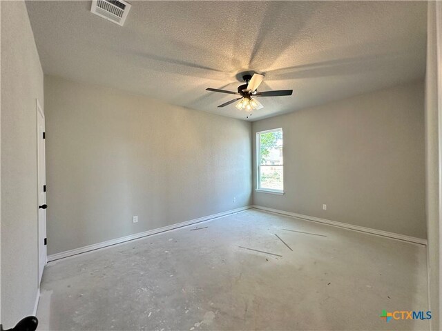 2598 Settlers Oak Dr, Belton, TX 76513 - empty room featuring a ceiling fan, baseboards, unfinished concrete flooring, and a textured ceiling