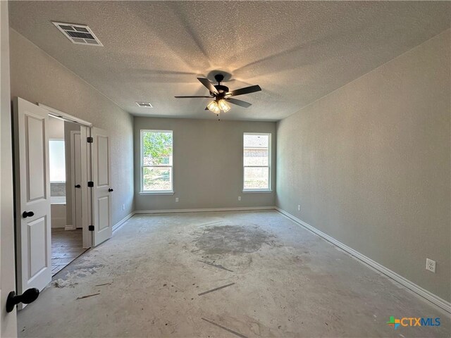 2598 Settlers Oak Dr, Belton, TX 76513 - spare room with healthy amount of natural light, a ceiling fan, a textured ceiling, and baseboards
