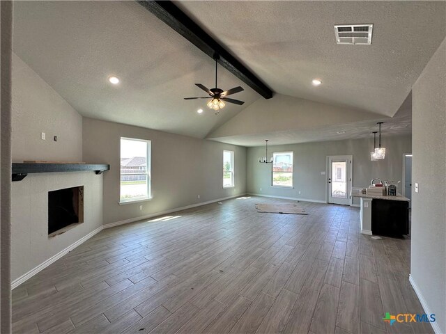 2598 Settlers Oak Dr, Belton, TX 76513 - unfurnished living room featuring wood finished floors, ceiling fan, baseboards, a textured ceiling, and recessed lighting