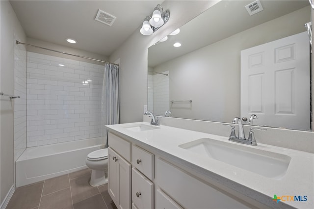 11820 Offaly Dr, Austin, TX 78754 - full bathroom featuring tile patterned flooring, shower / tub combo, double vanity, and recessed lighting