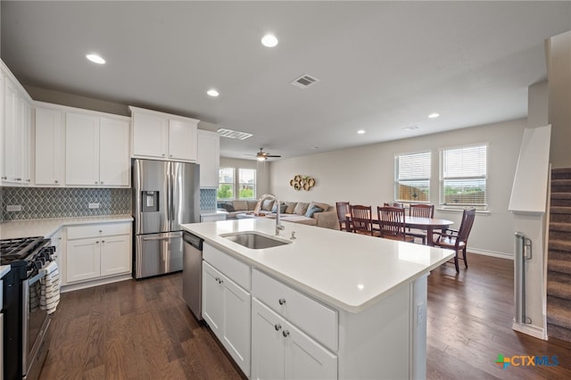 11820 Offaly Dr, Austin, TX 78754 - kitchen with stainless steel appliances, dark wood-type flooring, light countertops, and recessed lighting