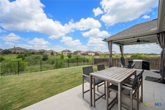 11820 Offaly Dr, Austin, TX 78754 - fenced backyard featuring a patio, a residential view, outdoor dining area, area for grilling, and ceiling fan