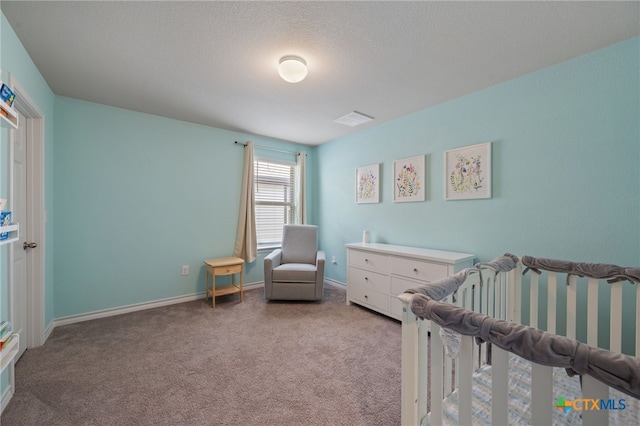 11820 Offaly Dr, Austin, TX 78754 - bedroom featuring a nursery area and light colored carpet
