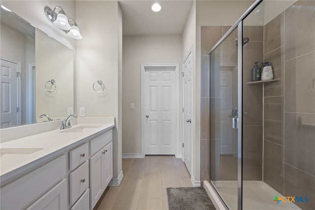 11820 Offaly Dr, Austin, TX 78754 - bathroom featuring double vanity, a stall shower, and tile patterned floors