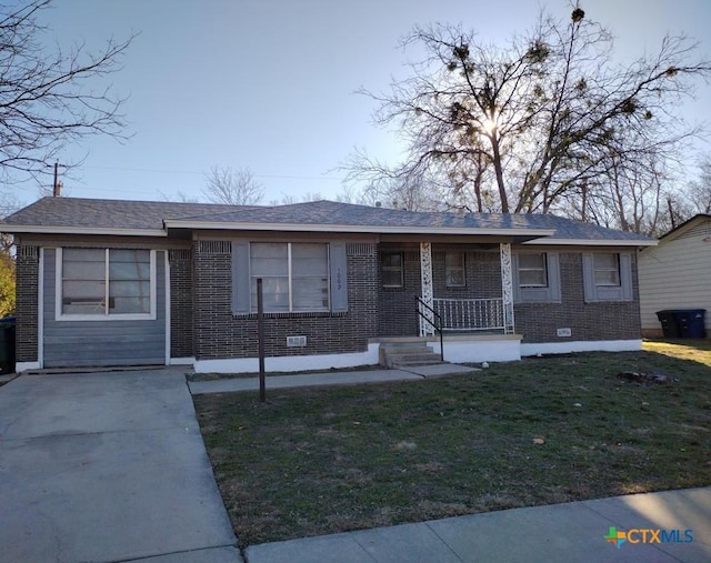 single story home with covered porch and a front lawn