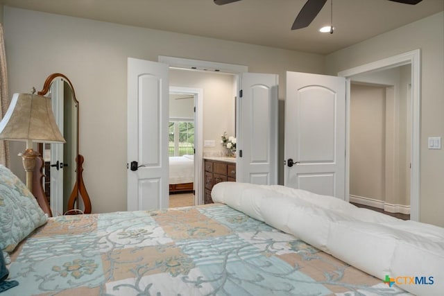 bedroom with a ceiling fan and connected bathroom