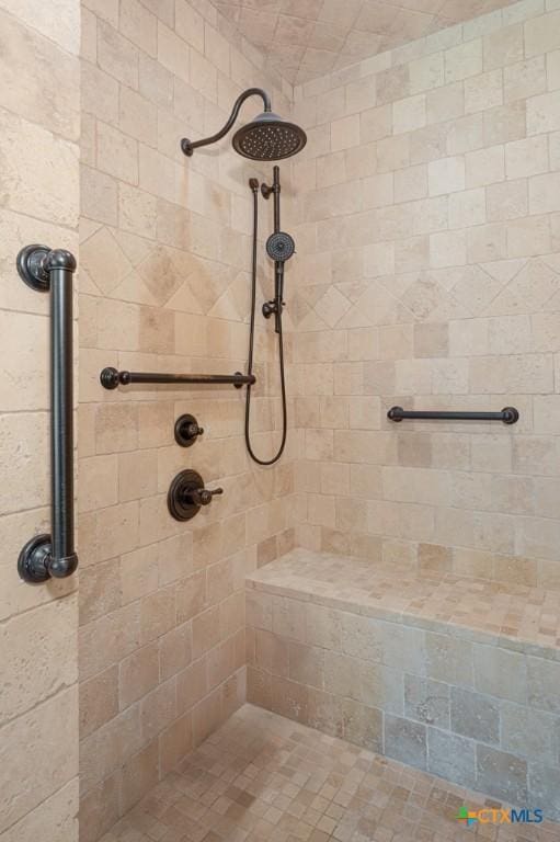 bathroom with tiled shower