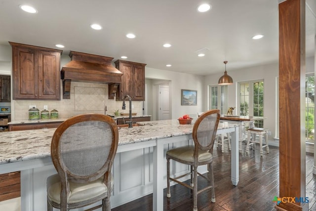 kitchen with tasteful backsplash, dark wood-style flooring, and recessed lighting