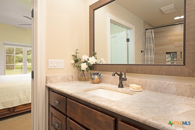 full bath featuring visible vents, a shower with shower curtain, and vanity