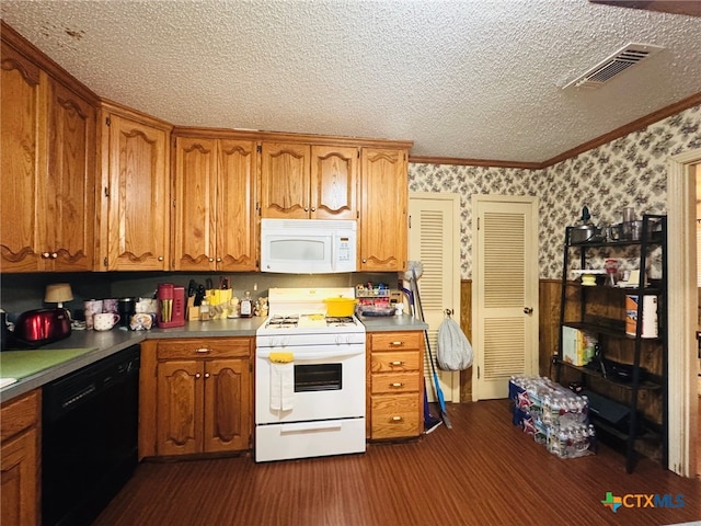 2405 Oak Dr, Gatesville, TX 76528 - kitchen featuring white appliances, a textured ceiling, wallpapered walls, brown cabinets, and ornamental molding