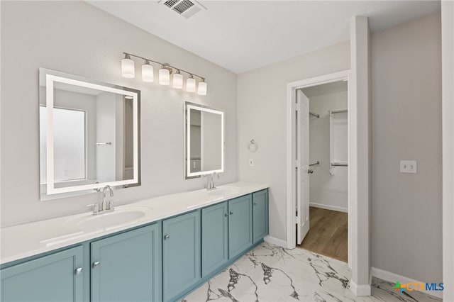 3300 Porter Creek Cv, Round Rock, TX 78665 - full bath featuring visible vents, marble finish floor, double vanity, and a sink