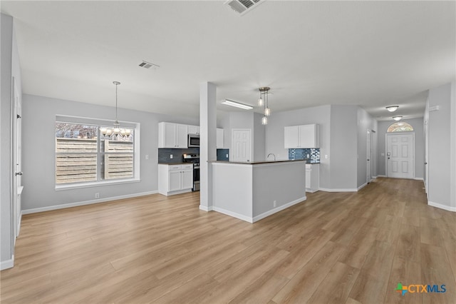 3300 Porter Creek Cv, Round Rock, TX 78665 - kitchen with visible vents, white cabinetry, and open floor plan