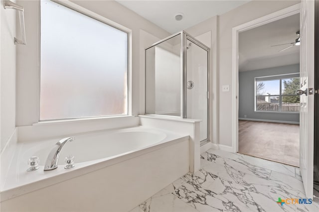 3300 Porter Creek Cv, Round Rock, TX 78665 - bathroom with a stall shower, ceiling fan, a bath, and marble finish floor