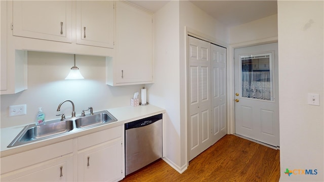 210 Londonderry Dr, Victoria, TX 77901 - kitchen featuring stainless steel dishwasher, wood finished floors, light countertops, and white cabinets