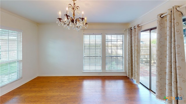 210 Londonderry Dr, Victoria, TX 77901 - spare room featuring ornamental molding, a chandelier, and wood finished floors
