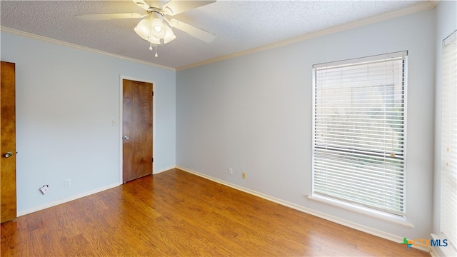 210 Londonderry Dr, Victoria, TX 77901 - spare room with wood finished floors, ornamental molding, ceiling fan, and a textured ceiling