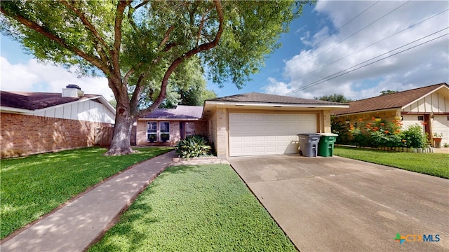 210 Londonderry Dr, Victoria, TX 77901 - single story home with brick siding, a front yard, a garage, and driveway