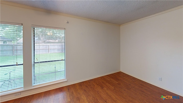 210 Londonderry Dr, Victoria, TX 77901 - unfurnished room with ornamental molding, healthy amount of natural light, a textured ceiling, and wood finished floors