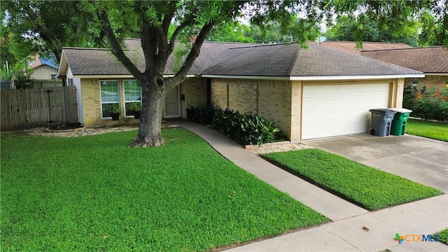 210 Londonderry Dr, Victoria, TX 77901 - ranch-style house with brick siding, a garage, driveway, and roof with shingles