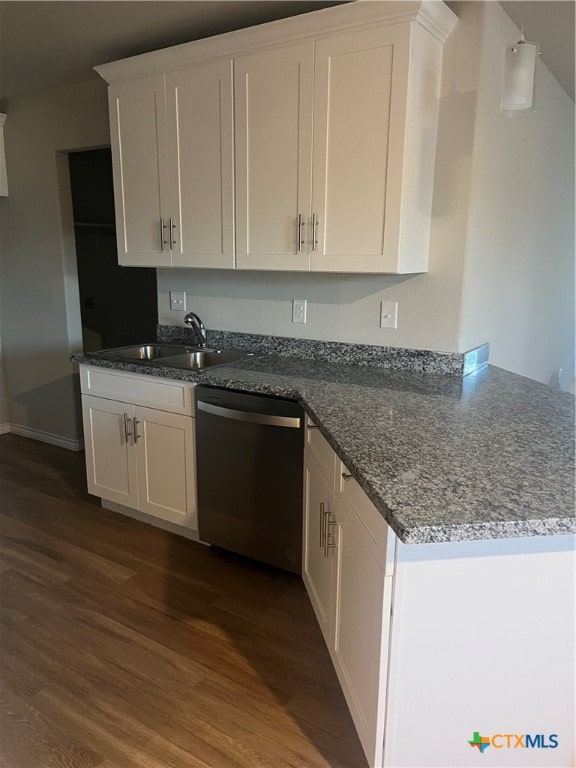 kitchen featuring dark hardwood / wood-style floors, white cabinetry, sink, and dishwasher