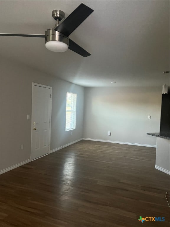 interior space with ceiling fan