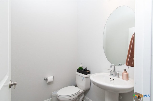 bathroom featuring sink and toilet