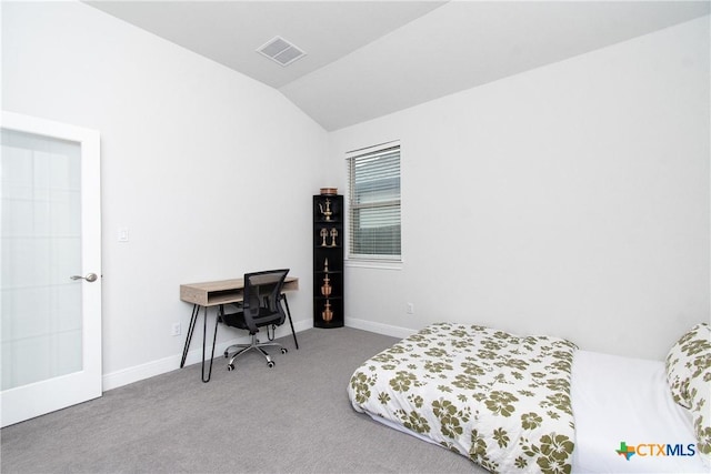 carpeted bedroom featuring lofted ceiling