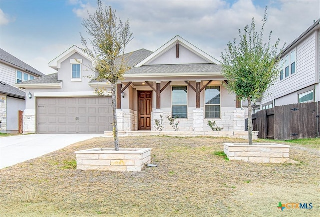 view of front facade with a garage and a front yard