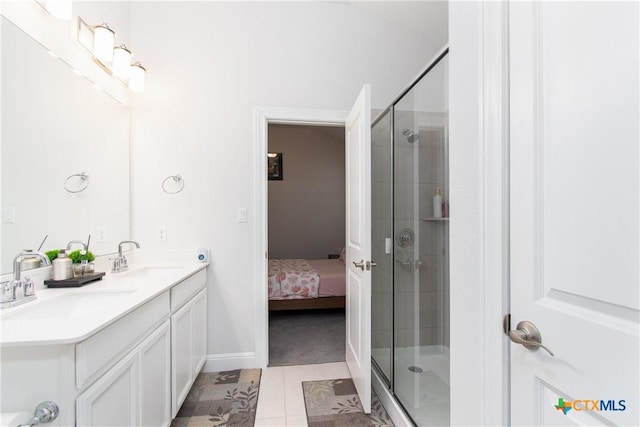 bathroom featuring walk in shower, tile patterned floors, and vanity