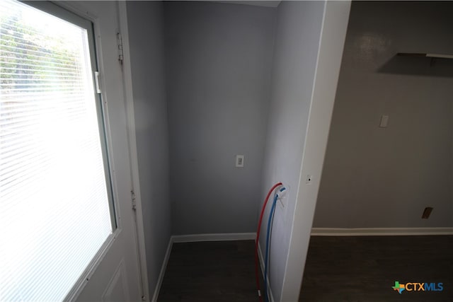 hallway with dark hardwood / wood-style floors