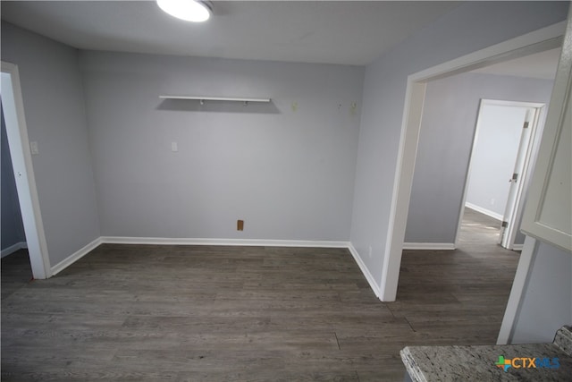 empty room featuring dark hardwood / wood-style flooring