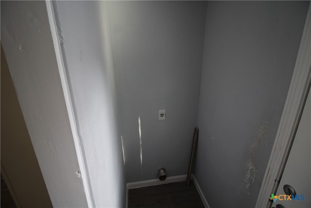 laundry room with electric dryer hookup and dark hardwood / wood-style floors