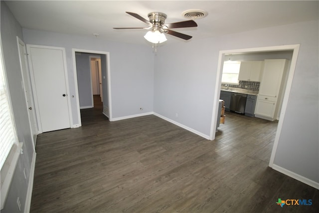 spare room with ceiling fan and dark hardwood / wood-style flooring