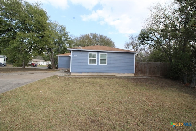 exterior space with a lawn and a garage