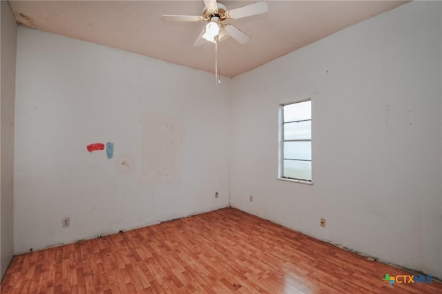 spare room with light hardwood / wood-style floors and ceiling fan