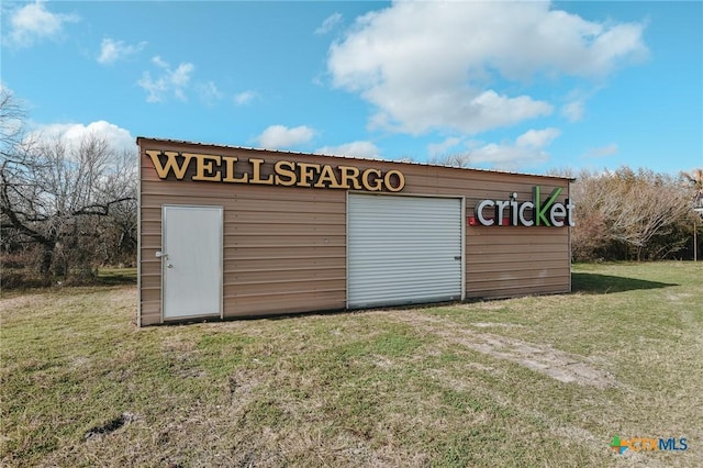 garage with a lawn